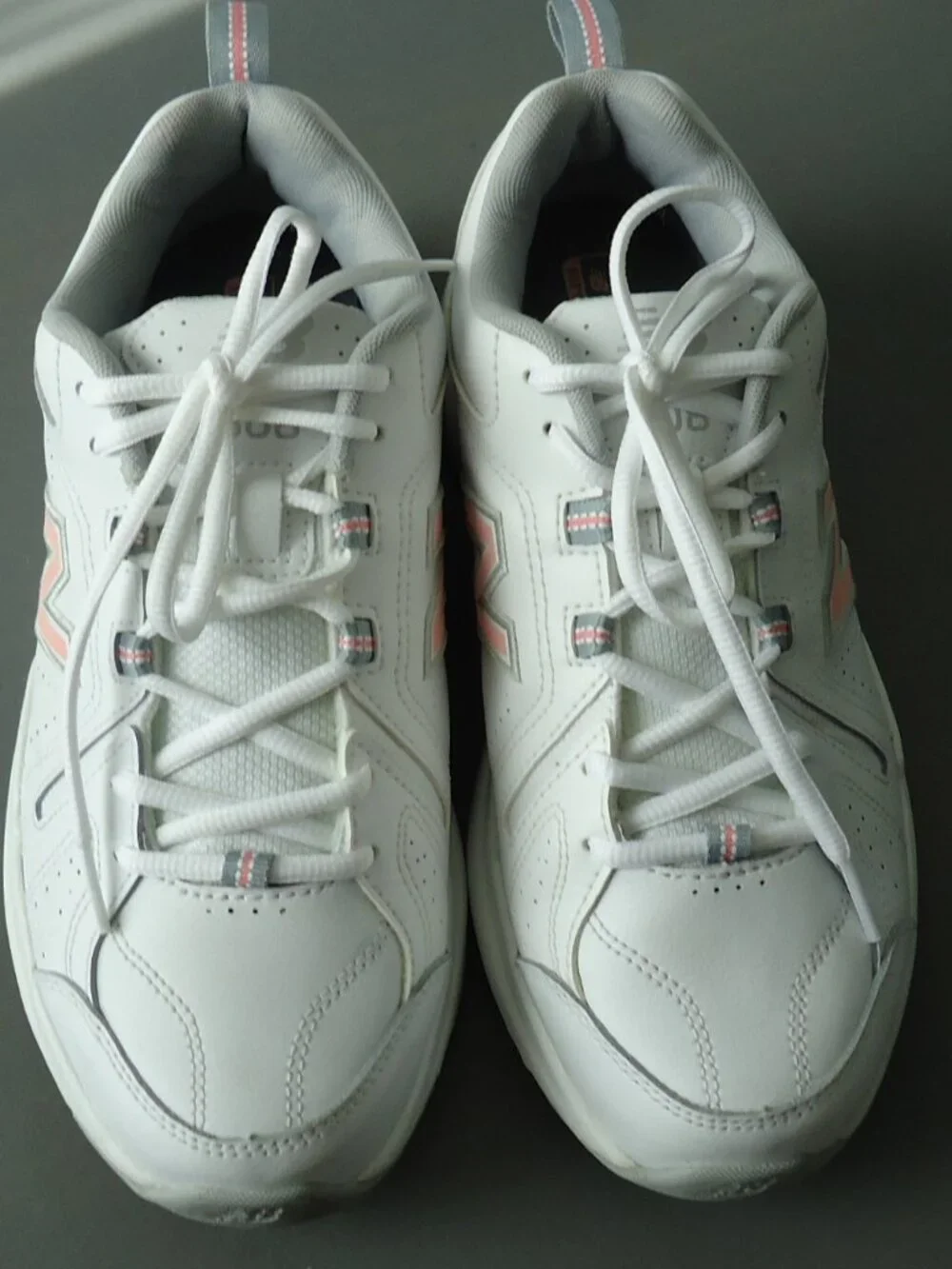 SIZE 9.5. D. New Balance women's white leather sneakers shoes.